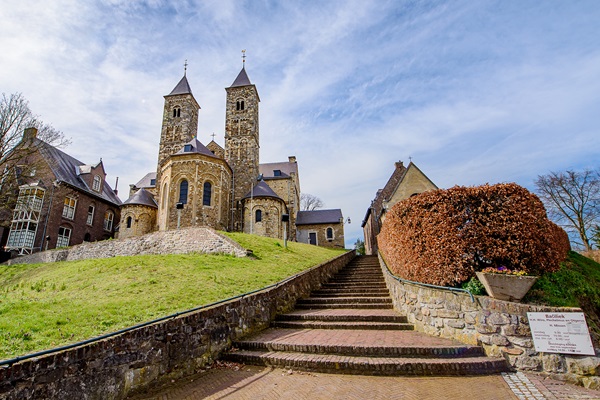 The Basilica of St. Odiliënberg on a summer day, seen from below the hill where the church stands