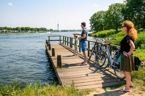 Family waits for the ferry at Ool in Roermond municipality